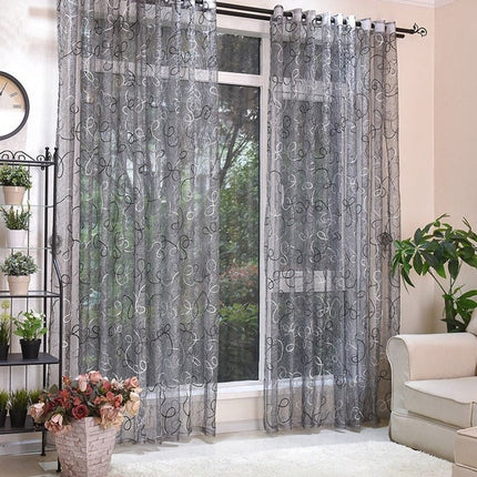 Transparente Gardine mit verspielter Stickerei